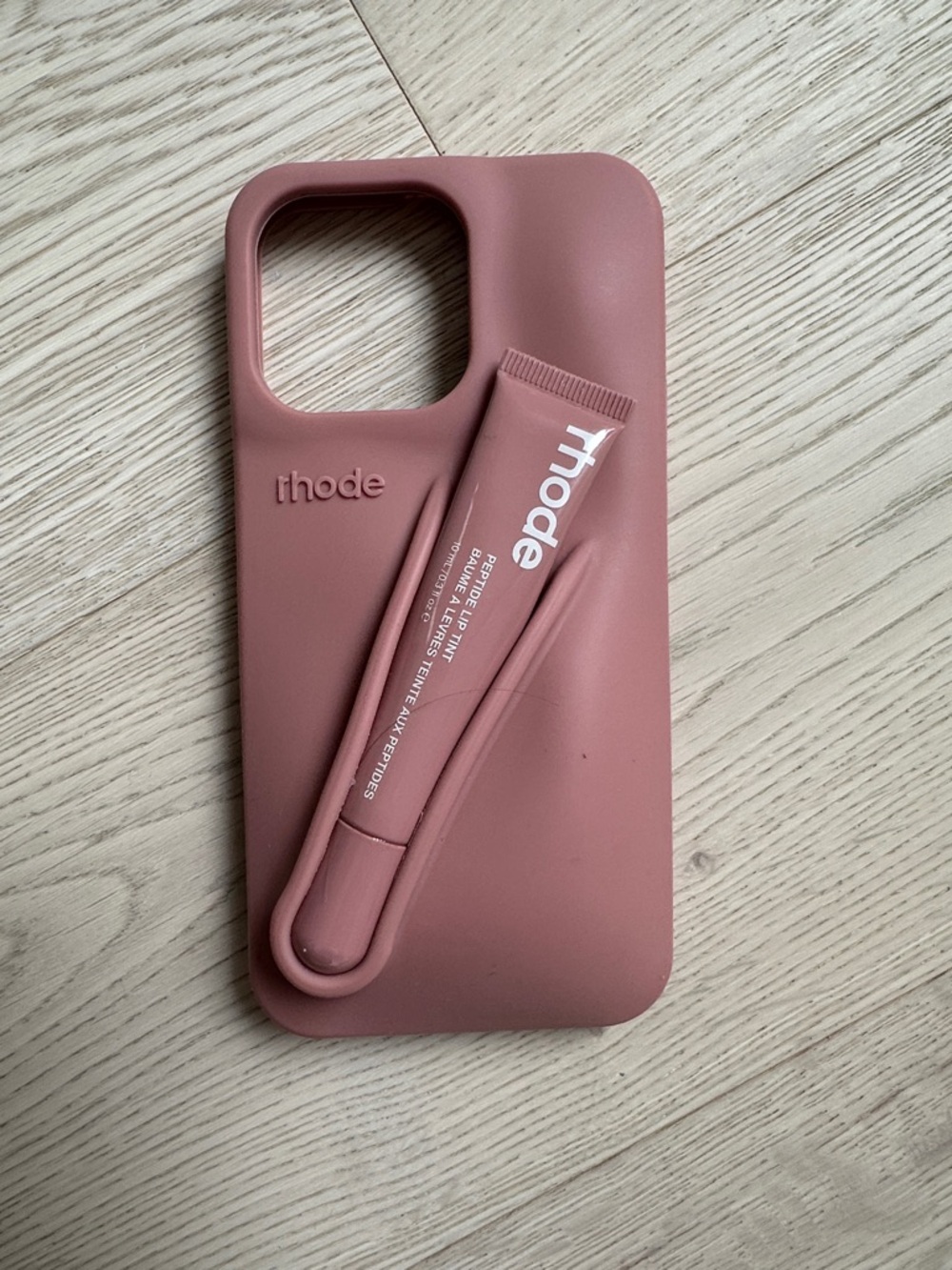 RHODE Blush Pink Silicone iPhone Case with Built-In lip gloss holder